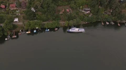 4k video from a drone, the ship sails to the river bank in summer Stock Footage 149073977
