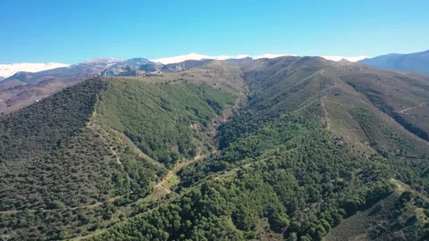 4K video from a drone of the snow-capped mountains of the Sierra Nevada Stock Footage 329807207