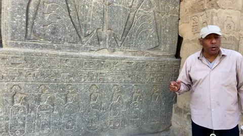 4K video of an Egyptian guide explaining to tourists the meaning of the Stock Footage 164507722