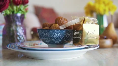 4K Video Eid Mubarak Table Setting Sweet Dishes Decorative Elements Stock Footage 330422619