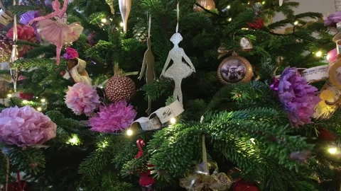 4K Video Elegant Christmas Tree Decorated Ballet Dancers and Flowers Stock Footage 330423023