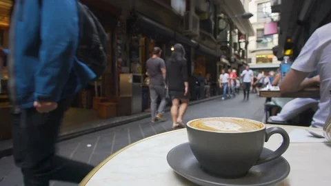 4k video of enjoying coffee in a laneway cafe in Melbourne Stock Footage 75045128