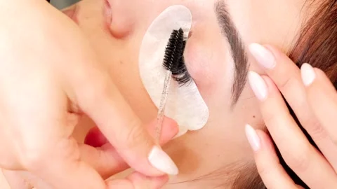 4k video of extension lashes comb and roll Stock Footage 272234339