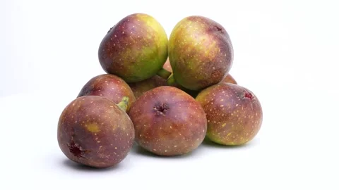 4K video of figs stacked and turned on a white background. Stock Footage 310114432