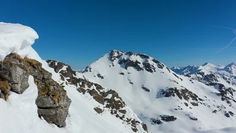 4K video flying close to mountain ridge with deep snow Stock Footage 103999130