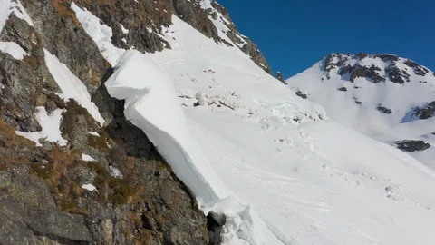 4K video flying close over snow cracks in winter mountains Stock Footage 103998516