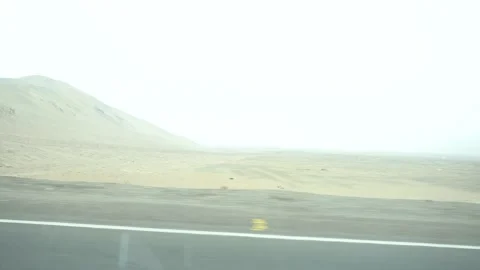 4k video footage looking out the window of a moving car watching dunes Stock Footage 144358096