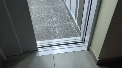 4K video. Gray elevator door opening in house. Hallway light turning on Stock Footage 348143811