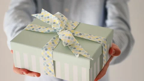 4K video of hands giving present box with bow at christmas Stock Footage 164017388