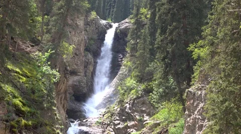 4K video of high waterfall in mountain spruce forest. Kyrgyzstan 库存影片 64029143