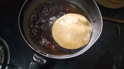 4K Video of Indian Puri making for eating. Stock Footage 296400209