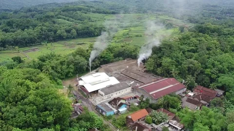 4k video of an industrial area surrounded by rural houses Stock Footage 295696587