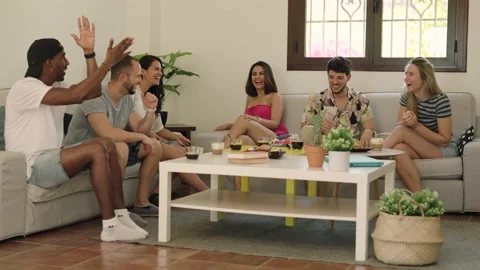 4K video of a interracial group of friends celebrate an afternoon snack Stock Footage 219967719