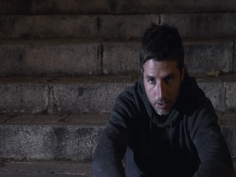 4K video lateral panning 24 fps of young wasted man in stress on street Stock Footage 71722509