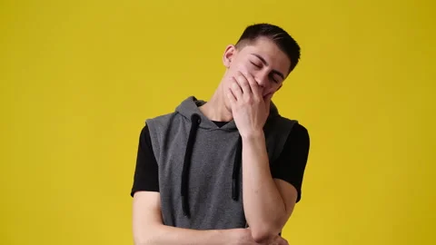 4k video of a man thinking about something over yellow background.b Stock Footage 234470103