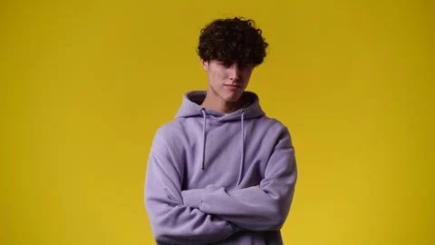 4k video of a man thinking about something over yellow background. Stock Footage 241995661