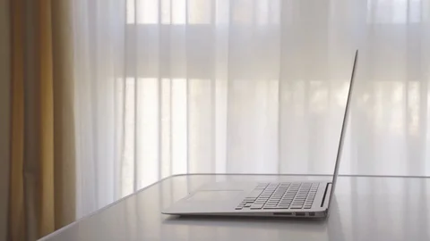 4k video of man using his tablet in front of his laptop. Concept of new techn Stock Footage 129909471