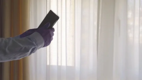 4k video of man using his tablet with gloves on to protect himself from the c Stock Footage 129909487