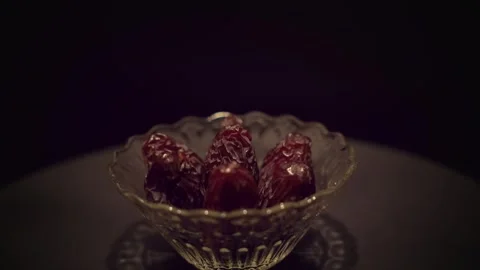 4K Video Medjool Dates Served in Glass Bowl Showing Wrinkled Texture Stock Footage 330424478