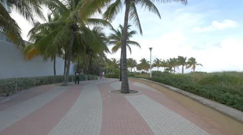 4k video Men walking on the beach side, Miami Beach Stock Footage 47545407