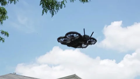 4K video of a mini drone flying in the sky and landing gently on a man hand Stock Footage 342078700