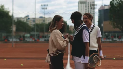 4k video. Multinational double amateur tennis match. Shaking hands and hug after Stock Footage 232467652
