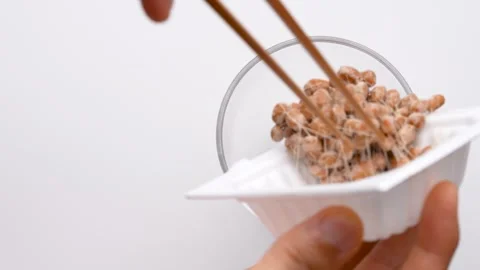 4K video of natto being transferred to a container. Stock Footage 249979802