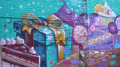4K video. An old brick wall with patterns and artistic graffiti. Stock Footage 229025410