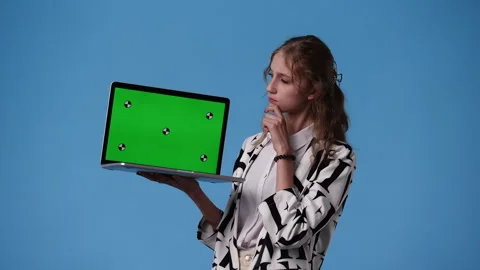 4k video of one girl using chroma key laptop and thinking about something over Stock Footage 240771785