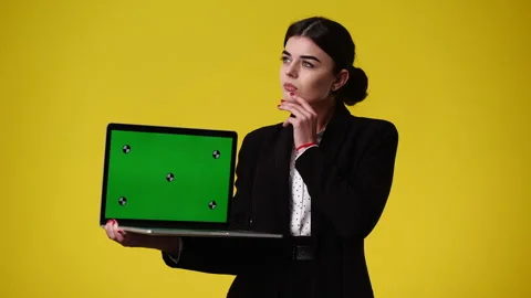 4k video of one girl using chroma key laptop and thinking about something over Stock Footage 241042707
