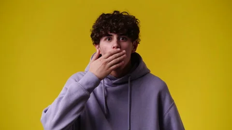 4k video of one man being very emotional over yellow background. Video stock 237542933