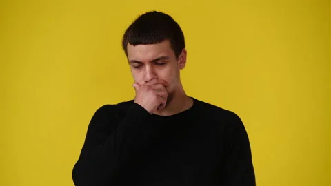 4k video of one man being very emotional over yellow background. Stock Footage 239828791