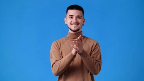 4k video of one man clapping over blue background. Stock Footage 234534593