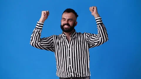 4k video of one man dancing and smiling over blue background. Stock Footage 233113975
