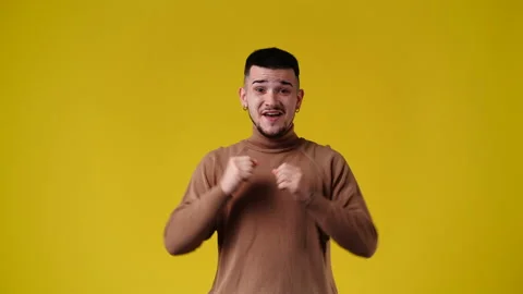 4k video of one man with negative facial expression on blue background. Video stock 233070179