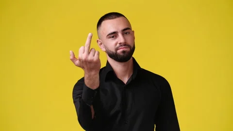 4k video of one man with a negative expression on his face, points his middle Stock Footage 235489631