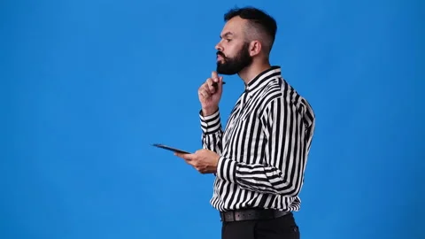 4k video of one man plans something with pen in hand and note over blue Stock Footage 233227205