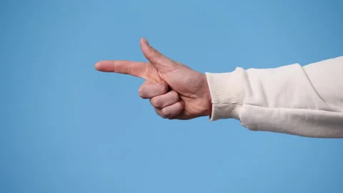 4k video of one man pointing at left and showing thumb up on blue background. Stock Footage 237637524
