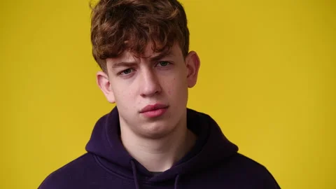 4k video of one man posing for a video over yellow background. Stock Footage 231646480
