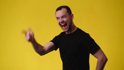 4k video of one man posing for a video on yellow background. Stock Footage 237235458