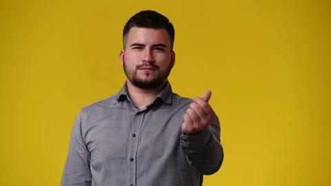 4k video of one man posing for a video over yellow background. Video stock 237506264