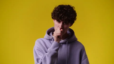 4k video of one man posing for a video over yellow background. Stock Footage 240750199