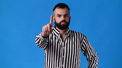 4k video of one man with positive facial expression showing finger. Stock Footage 235238755