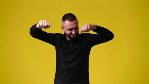 4k video of one man smiling and dancing over yellow background. Video stock 233231266