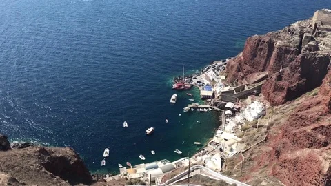 4k video. The panoramic view of port of Ammoudi in Oia Santorini, Greece Stock Footage 82300124
