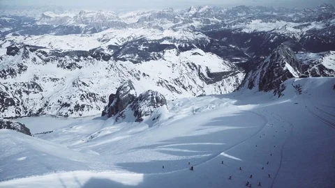 4k video with panoramic view of skiers seen from the top of Marmolada Stock Footage 103614616