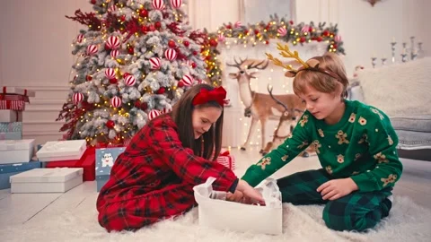 4k video portrait of two cute little children eating Christmas sweets. Craft Stock Footage 166534573