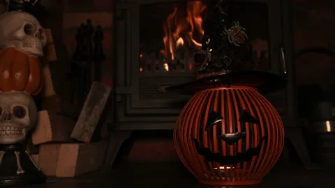4k video of pumpking Hat on spooky fire place. wram flickering backlight from Stock Footage 140882318