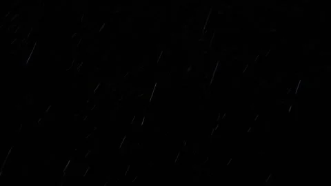 4K video of rain falling at night, illuminated by backlight. Raindrops visible Stock Footage 317950479