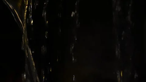 4K video of rain falling at night, illuminated by backlight. Raindrops visible Stock Footage 317950581